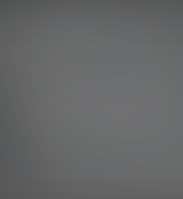 A minimalistic and neutral gradient background with soft gray tones, creating a clean and modern aesthetic.