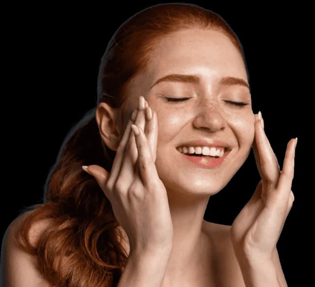 Radiant woman with glowing skin enjoying a skincare treatment at a dermatology clinic.